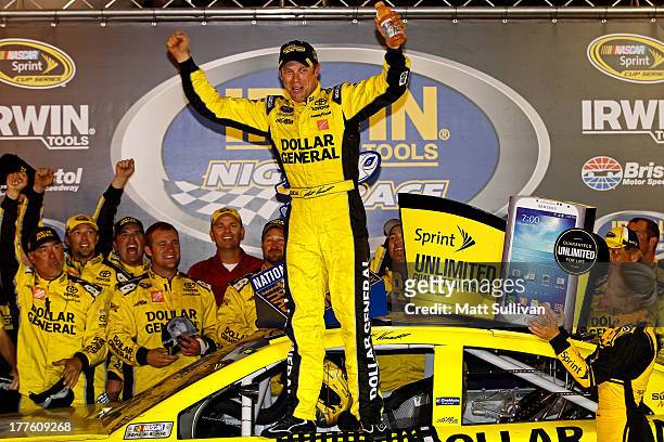 Matt Kenseth, driver of the Dollar General Toyota, celebrates in Victory Lane after winning the NASCAR Sprint Cup Series 53rd Annual IRWIN Tools...