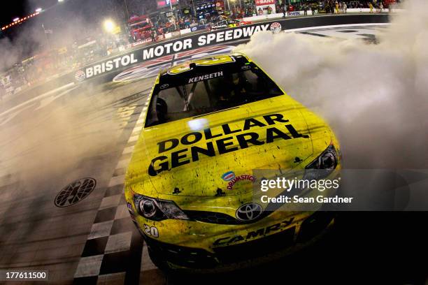 Matt Kenseth, driver of the Dollar General Toyota, celebrates with a burnout after winning the NASCAR Sprint Cup Series 53rd Annual IRWIN Tools Night...