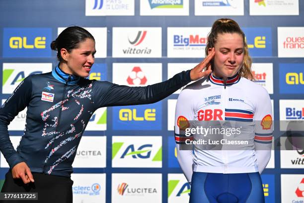 Silver medalist Marie Schreiber of Luxembourg, gold medalist Jane Zoe Backstedt of Great Britain pose on the podium during the medal ceremony after...