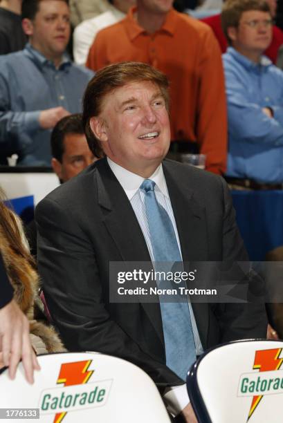 Real Estate Mogul Donald Trump sits courtside of the Washington Wizards and New Jersey Nets game at Continental Airlines Arena on January 29, 2003 in...