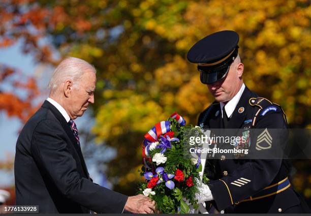 President Joe Biden, left, participates in a Presidential Armed Forces Full Honor Wreath-Laying Ceremony at the Tomb of the Unknown Soldier at...