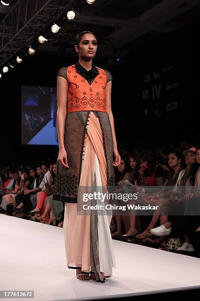 Model showcases designs by Sougat Paul on the runway during day 2 of Lakme Fashion Week Winter/Festive 2013 at the Hotel Grand Hyatt on August 24,...