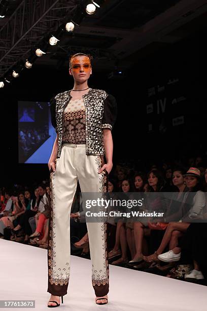 Model showcases designs by Sougat Paul on the runway during day 2 of Lakme Fashion Week Winter/Festive 2013 at the Hotel Grand Hyatt on August 24,...