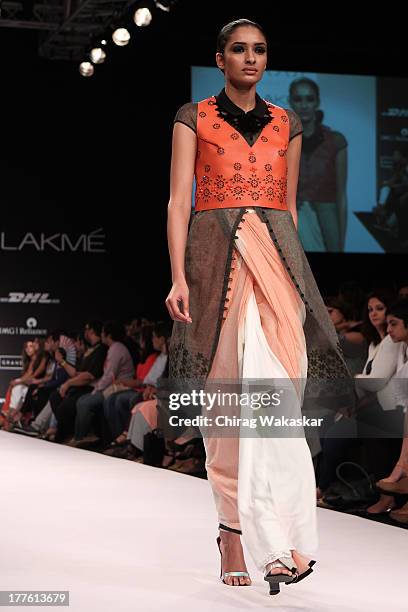 Model showcases designs by Sougat Paul on the runway during day 2 of Lakme Fashion Week Winter/Festive 2013 at the Hotel Grand Hyatt on August 24,...