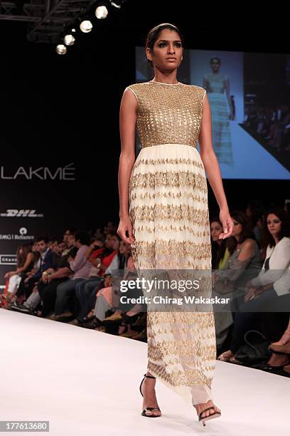 Model showcases designs by Sougat Paul on the runway during day 2 of Lakme Fashion Week Winter/Festive 2013 at the Hotel Grand Hyatt on August 24,...