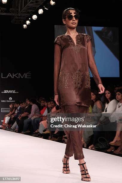 Model showcases designs by Sougat Paul on the runway during day 2 of Lakme Fashion Week Winter/Festive 2013 at the Hotel Grand Hyatt on August 24,...