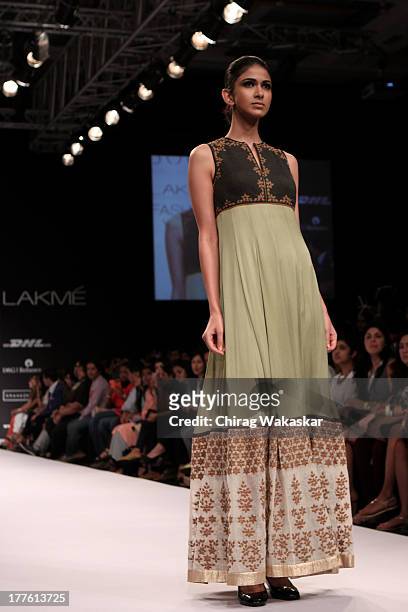 Model showcases designs by Sougat Paul on the runway during day 2 of Lakme Fashion Week Winter/Festive 2013 at the Hotel Grand Hyatt on August 24,...