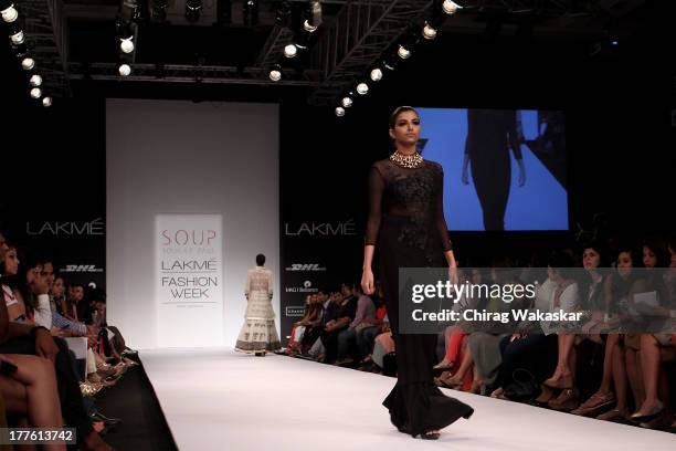 Model showcases designs by Sougat Paul on the runway during day 2 of Lakme Fashion Week Winter/Festive 2013 at the Hotel Grand Hyatt on August 24,...