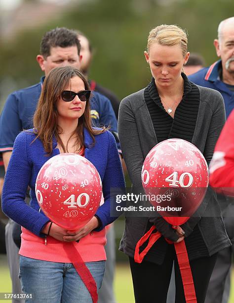 Sarah Harper , the girlfriend of Christopher Lane and Erin Lane, sister of Christopher Lane stand for a minute's silence and the release of balloons...