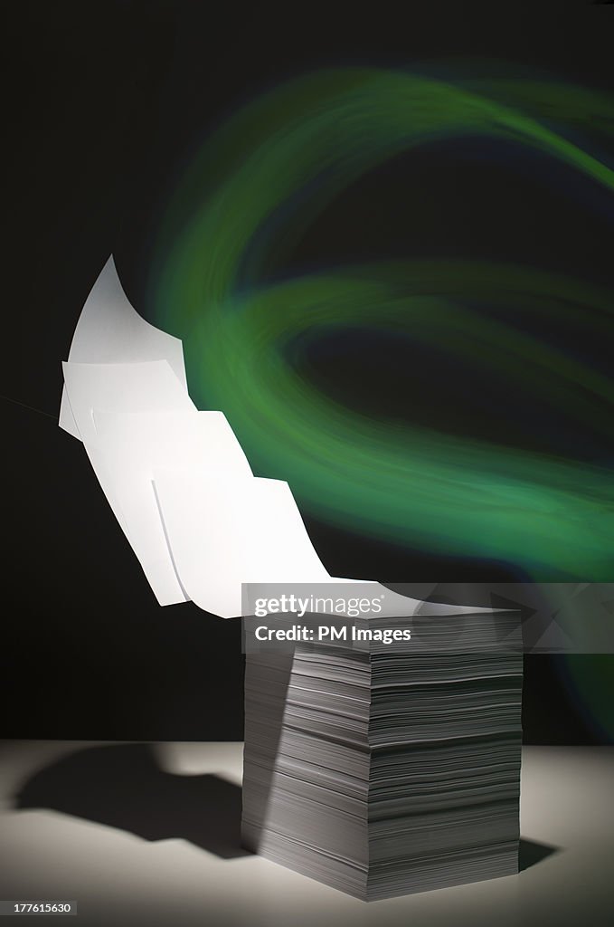 Green light lifting paper off stack