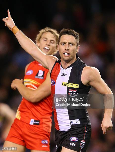 Stephen Milne of the Saints celebrates a goal during the round 22 AFL match between the St Kilda Saints and the Gold Coast Suns at Etihad Stadium on...