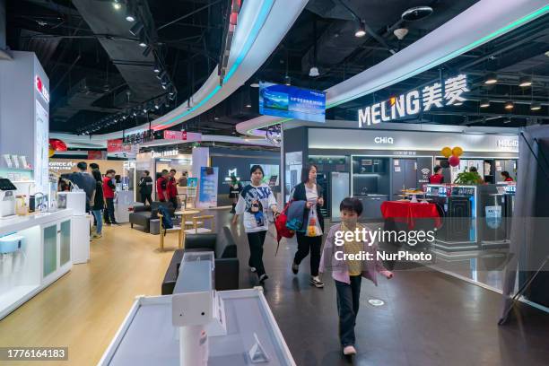 People buy home appliances at the Jingdong Electric Super Experience Store in Chongqing, China, November 11, 2023. It is reported that as of 0:00 on...