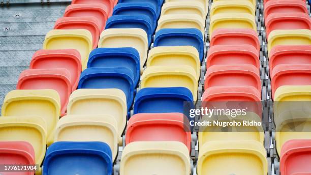 colorful empty chair in sport tribune in diagonal row - tribune tower stock pictures, royalty-free photos & images