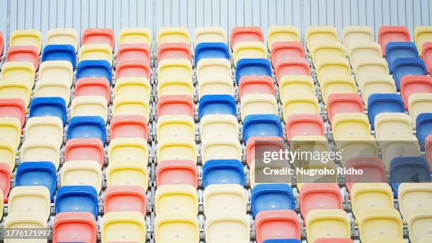 colorful stadium tribune chairs in row - tribune tower stock pictures, royalty-free photos & images