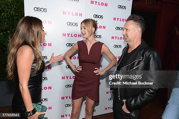 Publisher Jaclynn Jarrett, actress Emily VanCamp and Editor in chief of Nylon Magazine Marvin Scott Jarrett, attend the NYLON September Issue Party...