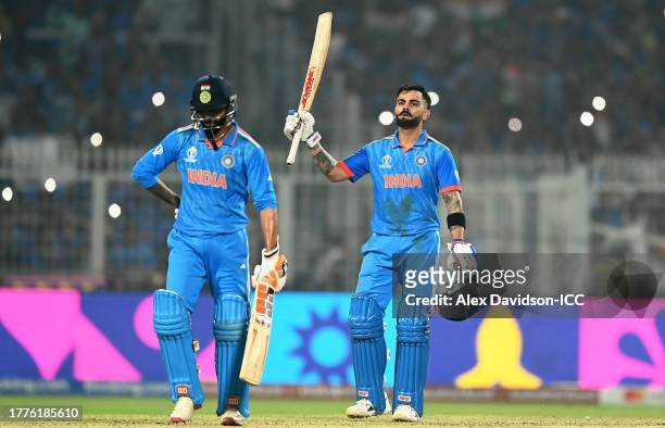 Virat Kohli of India celebrates their century with team mate Ravi Jadeja to equal Sachin Tendulkar's record for most ODI centuries for India during...