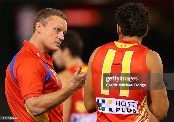 Suns coach Guy Mckenna speaks to Harley Bennell during the round 22 AFL match between the St Kilda Saints and the Gold Coast Suns at Etihad Stadium...