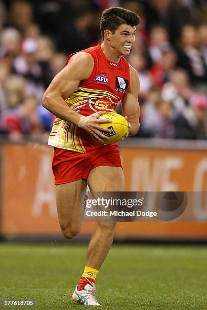 Jaeger O'Meara of the Suns runs with the ball during the round 22 AFL match between the St Kilda Saints and the Gold Coast Suns at Etihad Stadium on...