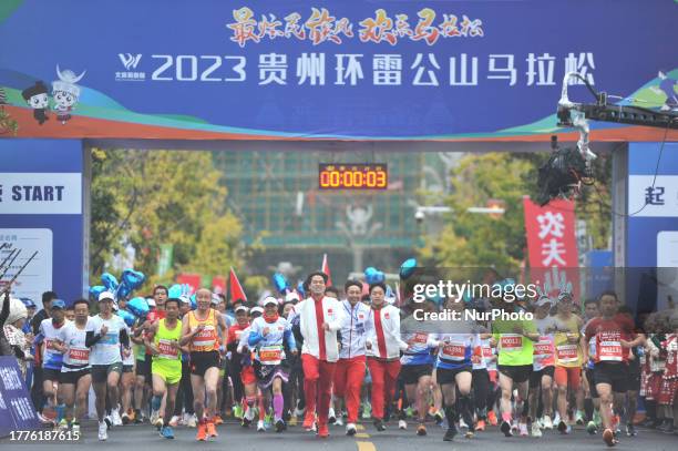 Participants run at the start of the 2023 Guizhou Ring Leigong Mountain Marathon in Leishan county, Qiandongnan, Guizhou Province, China, Nov 11,...