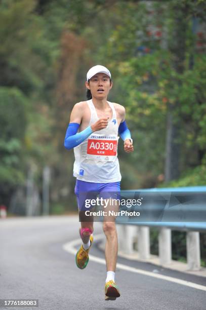 Participants run during the 2023 Guizhou Ring Leigong Mountain Marathon in Leishan county, Qiandongnan, Guizhou Province, China, Nov 11, 2023.