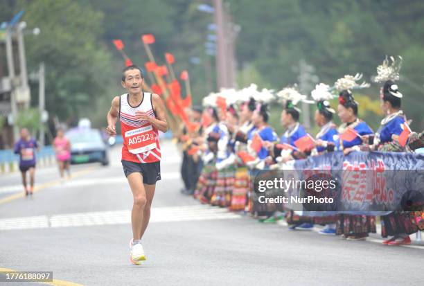 Participants run during the 2023 Guizhou Ring Leigong Mountain Marathon in Leishan county, Qiandongnan, Guizhou Province, China, Nov 11, 2023.