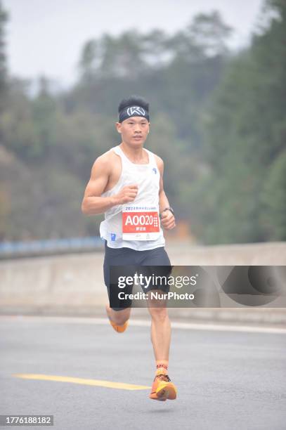 Participants run during the 2023 Guizhou Ring Leigong Mountain Marathon in Leishan county, Qiandongnan, Guizhou Province, China, Nov 11, 2023.