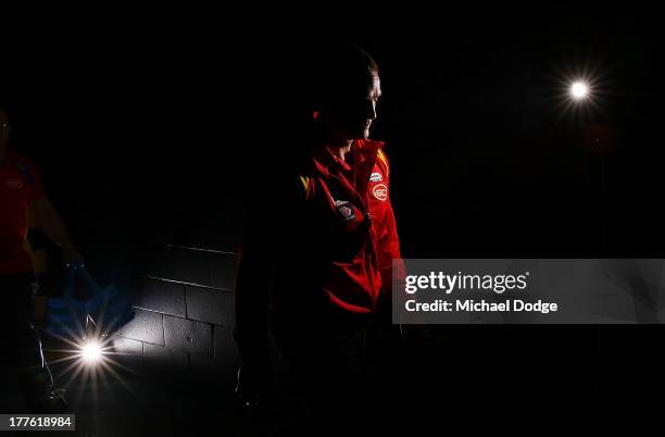 Suns coach Guy Mckenna walks out to the ground during the round 22 AFL match between the St Kilda Saints and the Gold Coast Suns at Etihad Stadium on...