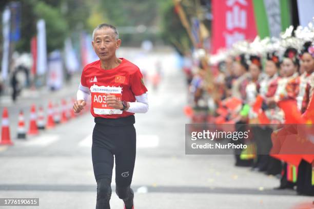 Participants run during the 2023 Guizhou Ring Leigong Mountain Marathon in Leishan county, Qiandongnan, Guizhou Province, China, Nov 11, 2023.