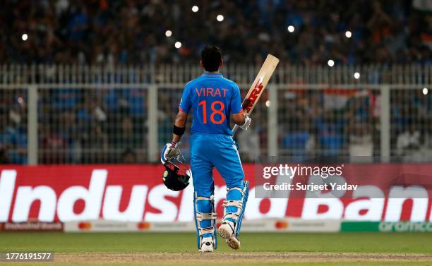 Virat Kohli of India celebrates their century to equal Sachin Tendulkar's record for most ODI centuries for India during the ICC Men's Cricket World...