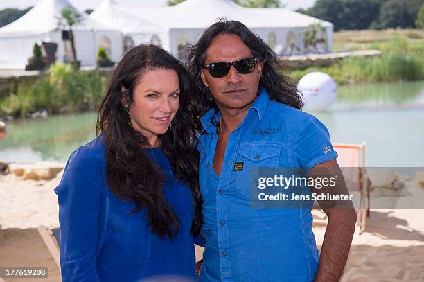 Christine Neubauer and Jose Campos take part in the 6th GRK Golf Charity Masters at Golf & Country Club Leipzig on August 24, 2013 in Leipzig,...