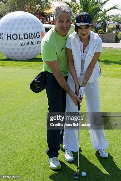 Anja Kruse and Karsten Speck take part in the 6th GRK Golf Charity Masters at Golf & Country Club Leipzig on August 24, 2013 in Leipzig, Germany.