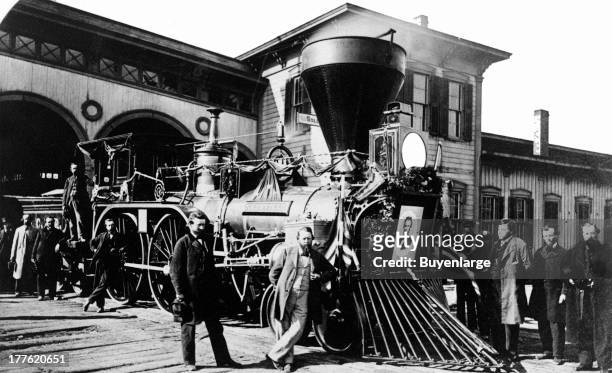 Cleveland, Columbus & Cincinnati Railroad engine, with a portrait of Abraham Lincoln mounted on the front, 1862. The engine was one of several used...