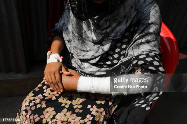 Majeda Sultana 25 years old a woman garment worker has been injured by bullet on her hand during clashes between police and garment workers demanding...