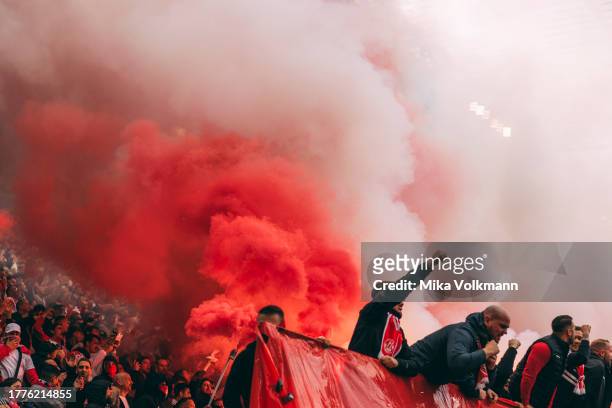 Fans fire bengal fire during the Bundesliga match between 1. FC Koeln and Borussia Moenchengladbach at RheinEnergieStadion on October 22, 2023 in...