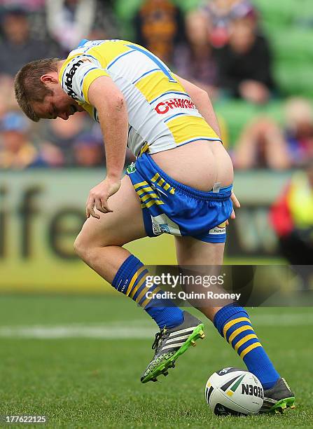 Jake Mullaney of the Eels has his shorts pulled down during the round 24 NRL match between the Melbourne Storm and the Parramatta Eels at AAMI Park...