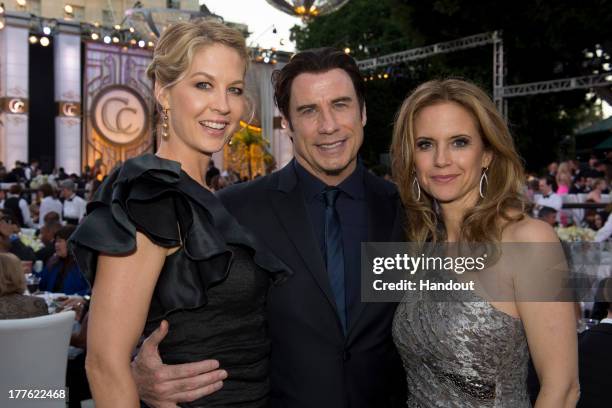 In this handout photo provided by Church of Scientology, Jenna Elfman, John Travolta and Kelly Preston attend the Church of Scientology Celebrity...