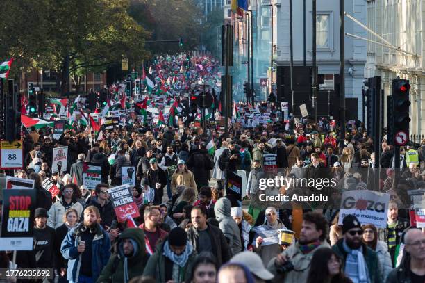 Tens of thousands of protesters march across Vauxhall Bridge in solidarity with the Palestinian people and demand an immediate ceasefire in Gaza on...