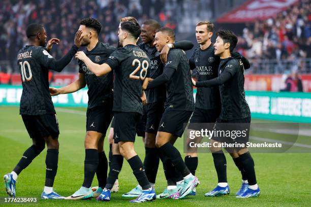 Kylian Mbappe of Paris Saint-Germain celebrates his goal with his teammates during the Ligue 1 Uber Eats match between Stade de Reims and Paris...