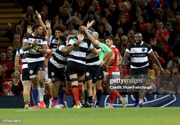 The Barbarians Team congratulate Alun Wyn Jones Captain of the Barbarians for scoring a try during the International match between Wales and...