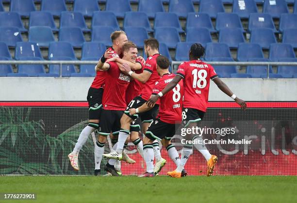 Marcel Halstenberg celebrates with teammates after scoring the team's second goal during the Second Bundesliga match between Hannover 96 and...