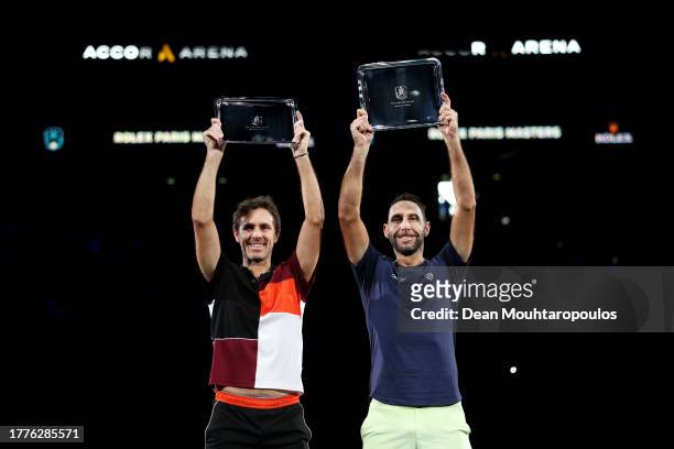 Winners Edouard Roger-Vasselin of France and Santiago Gonzalez of Mexico pose for a photo after winning the Men's Doubles final against Rohan Bopanna...