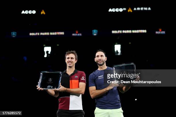 Winners Edouard Roger-Vasselin of France and Santiago Gonzalez of Mexico pose for a photo after winning the Men's Doubles final against Rohan Bopanna...