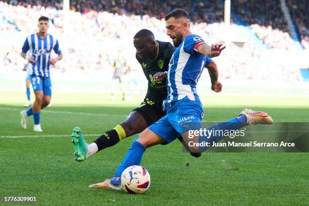 Luis Rioja of Deportivo Alaves duels for the ball with Houboulang Mendes of UD Almeria during the LaLiga EA Sports match between Deportivo Alaves and...