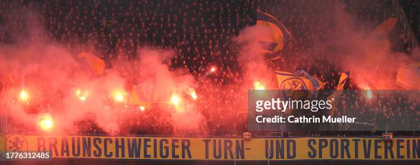 Fans of Eintracht Braunschweig burning flares durin the Second Bundesliga match between Hannover 96 and Eintracht Braunschweig at Heinz von Heiden...