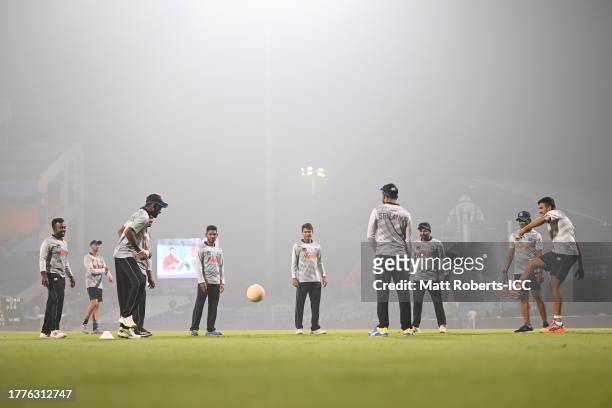 Players of Sri Lanka warm up during the ICC Men's Cricket World Cup India 2023 Bangladesh & Sri Lanka Net Sessions at Arun Jaitley Stadium on...
