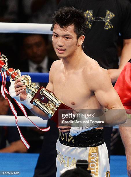 Ryota Murata of Japan celebrates after defeating Akio Shibata of Japan during his debut match as professional boxer against Akio Shibata at Ariake...