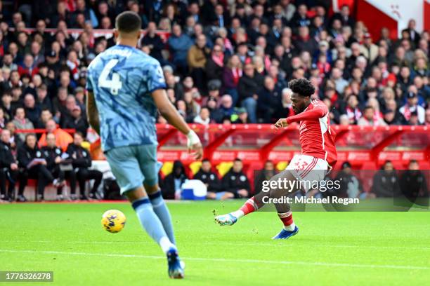 Ola Aina of Nottingham Forest scores the team's first goal during the Premier League match between Nottingham Forest and Aston Villa at City Ground...