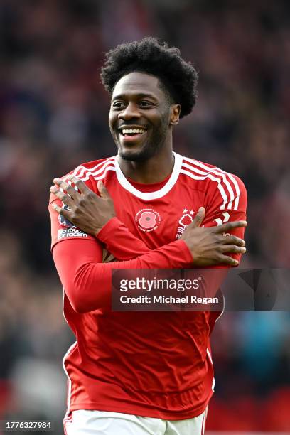 Ola Aina of Nottingham Forest celebrates after scoring the team's first goal during the Premier League match between Nottingham Forest and Aston...