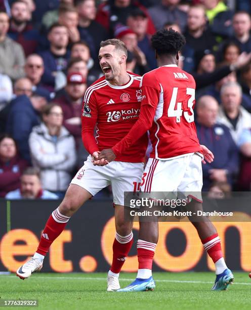 Ola Aina of Nottingham Forest celebrates scoring their teams first goal during the Premier League match between Nottingham Forest and Aston Villa at...
