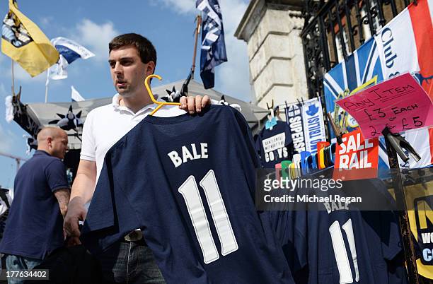 Cut price Gareth Bale merchandise is offered by vendors prior to kick off during the Barclays Premier League match between Tottenham Hotspur and...